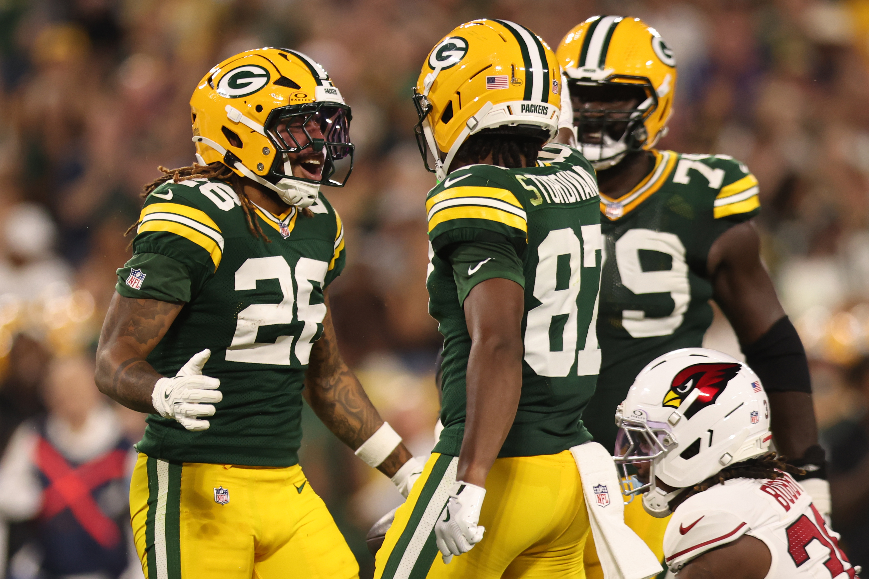 GREEN BAY, WISCONSIN - AUGUST 28: Damien Martinez #26 of the Green Bay Packers celebrates during the second quarter of a preseason game against the Arizona Cardinals at Lambeau Field on August 28, 2026 in Green Bay, Wisconsin.